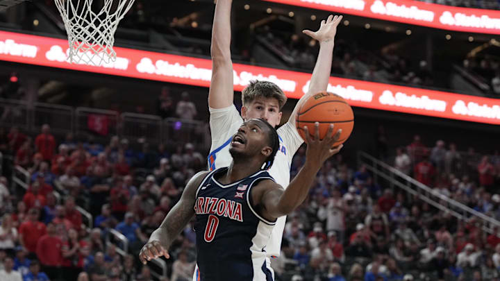 Nov 3, 2025; Las Vegas, NV, USA; Arizona Wildcats guard Jaden Bradley (0) shoots against Florida Gators forward Alex Condon (21) in the second half of the Hall of Fame Series game at T-Mobile Arena. Mandatory Credit: Candice Ward-Imagn Images