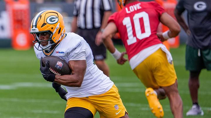 Green Bay Packers running back MarShawn Lloyd (32) runs through a drill during practice. 