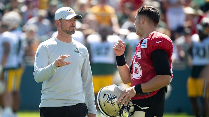 Green Bay Packers head coach Matt LaFleur speaks with New Orleans Saints Ian Book (16) at training camp practice with the New Orleans Saints on Wednesday, Aug. 17, 2022, at Ray Nitschke Field in Ashwaubenon, Wis. Samantha Madar/USA TODAY NETWORK-Wis.

Gpg Training Camp With Saints 08172022 0020