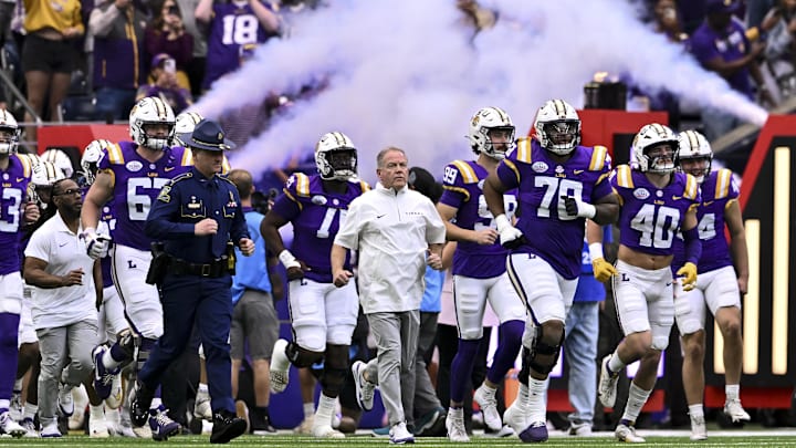 Dec 31, 2024; Houston, TX, USA; LSU Tigers head coach Brian Kelly enters the field with the team prior to the game against the Baylor Bears at NRG Stadium. Mandatory Credit: Maria Lysaker-Imagn Images 