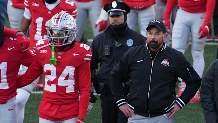 Ohio State University football coach Ryan Day tries to join the team to sing Carmen Ohio after the Michigan game Saturday, November 30, 2024 in Ohio Stadium. As he was standing here, the melee was starting behind him as Michigan players tried to plant a flag at midfield.