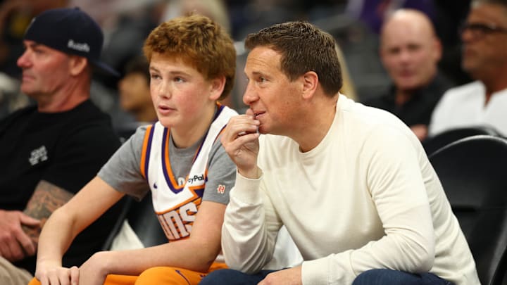 Oct 22, 2025; Phoenix, Arizona, USA; Phoenix Suns owner Mat Ishbia (right) with son Ben Ishbia in attendance against the Sacramento Kings at the Mortgage Matchup Center. Mandatory Credit: Mark J. Rebilas-Imagn Images Oct 22, 2025; Phoenix, Arizona, USA; Phoenix Suns owner Mat Ishbia (right) with son Ben Ishbia in attendance against the Sacramento Kings at the Mortgage Matchup Center. Mandatory Credit: Mark J. Rebilas-Imagn Images