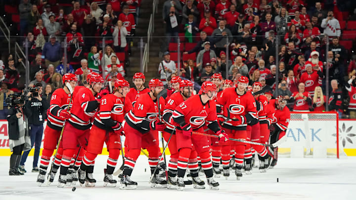 Dec 5, 2019; Raleigh, NC, USA;  Carolina Hurricanes players celebrate their win against the San Jose Sharks at PNC Arena. Mandatory Credit: James Guillory-Imagn Images