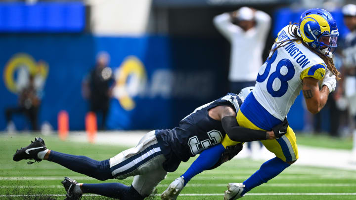 Aug 11, 2024; Inglewood, California, USA; Dallas Cowboys running back Snoop Conner (32) tackles Los Angeles Rams wide receiver Jordan Whittington (88) during the second quarter at SoFi Stadium. Mandatory Credit: Jonathan Hui-USA TODAY Sports