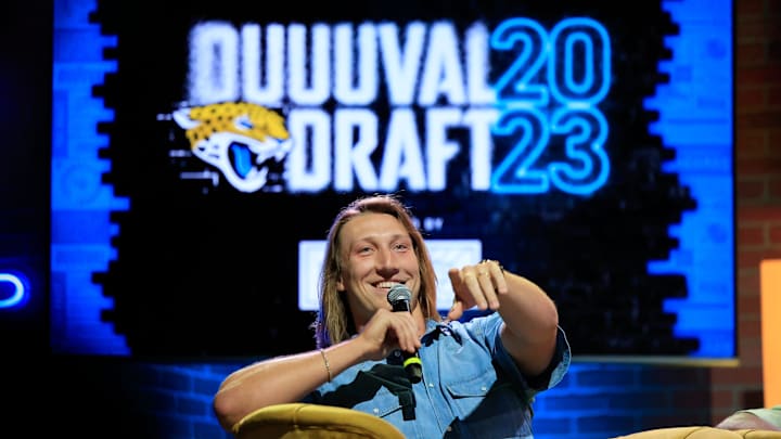 Jacksonville Jaguars quarterback Trevor Lawrence points receiving help finding a fan. Jacksonville Jaguars quarterback Trevor Lawrence points receiving help finding a fan.