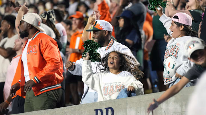 Oct 5, 2024; Berkeley, California, USA; Miami Hurricanes fans cheer during the fourth quarter against the California Golden Bears at California Memorial Stadium. Mandatory Credit: Darren Yamashita-Imagn Images