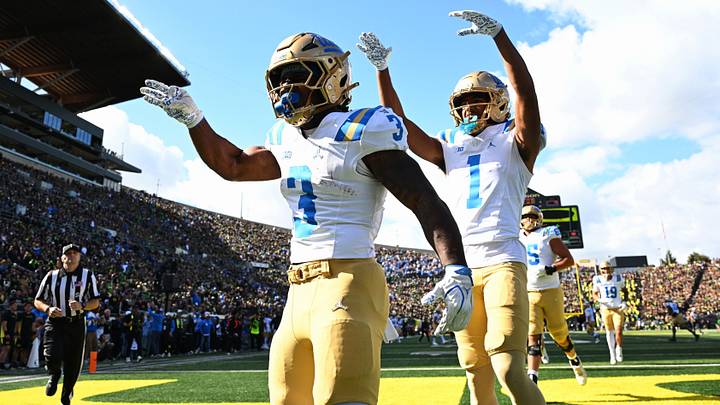 UCLA Bruins running back Wayne Knight (3) and UCLA Bruins wide receiver Aidan Mizell (1). 
