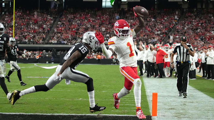 Oct 27, 2024; Paradise, Nevada, USA; Kansas City Chiefs wide receiver Xavier Worthy (1) scores on a 9-yard touchdown reception against Las Vegas Raiders cornerback Jack Jones (18) in the second half at Allegiant Stadium. Mandatory Credit: Kirby Lee-Imagn Images