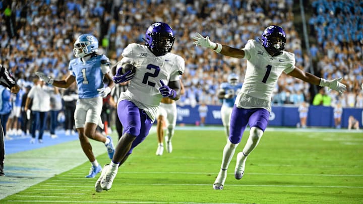 Sep 1, 2025; Chapel Hill, North Carolina, USA; TCU Horned Frogs running back Kevorian Barnes (2) scores a touchdown as safety Austin Jordan (1) celebrates and North Carolina Tar Heels defensive back Thaddeus Dixon (1) defends in the third quarter at Kenan Stadium. Mandatory Credit: Bob Donnan-Imagn Images Sep 1, 2025; Chapel Hill, North Carolina, USA; TCU Horned Frogs running back Kevorian Barnes (2) scores a touchdown as safety Austin Jordan (1) celebrates and North Carolina Tar Heels defensive back Thaddeus Dixon (1) defends in the third quarter at Kenan Stadium. Mandatory Credit: Bob Donnan-Imagn Images