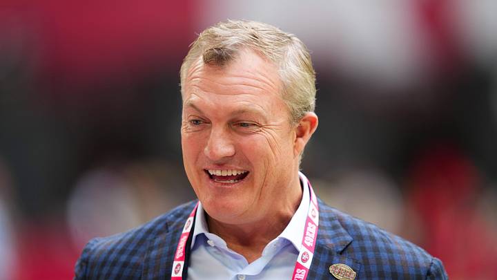 Nov 16, 2025; Glendale, Arizona, USA; San Francisco 49ers general manager John Lynch speaks on the sidelines before the game against the Arizona Cardinals at State Farm Stadium. Mandatory Credit: Joe Camporeale-Imagn Images