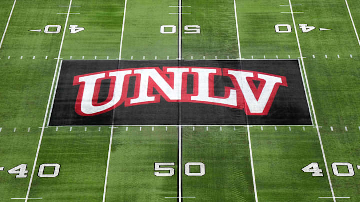 The UNLV Rebels logo at midfield during the Mountain West Championship at Allegiant Stadium. Mandatory Credit: Kirby Lee-Imagn Images The UNLV Rebels logo at midfield during the Mountain West Championship at Allegiant Stadium. Mandatory Credit: Kirby Lee-Imagn Images