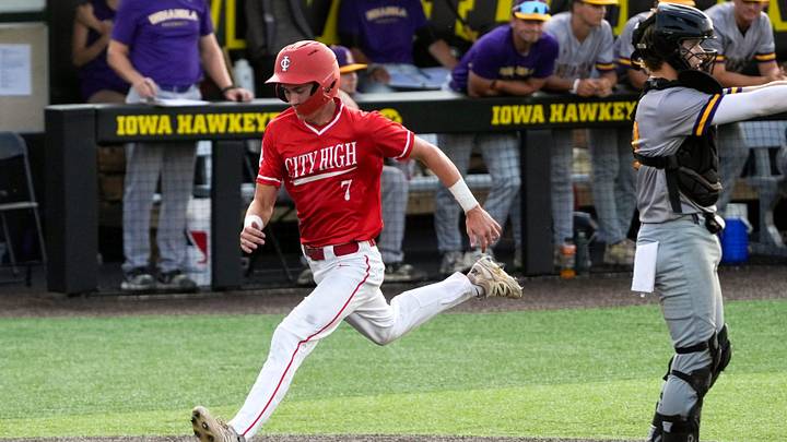 Iowa City High’s Paxton Bell (7) scores against Indianola during a regional final baseball game July 16, 2025 at Duane Banks Field in Iowa City, Iowa. Iowa City High’s Paxton Bell (7) scores against Indianola during a regional final baseball game July 16, 2025 at Duane Banks Field in Iowa City, Iowa.