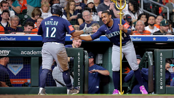 Sep 19, 2025; Houston, Texas, USA; Seattle Mariners first baseman Josh Naylor (12) is congratulated by Seattle Mariners center fielder Julio Rodriguez (44) after hitting a home run to right-center field against the Houston Astros during the eighth inning at Daikin Park. Mandatory Credit: Erik Williams-Imagn Images