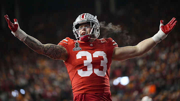 Ohio State Buckeyes defensive end Jack Sawyer (33) celebrates a sack of Tennessee Volunteers quarterback Nico Iamaleava (8) during the first half of the College Football Playoff first round game at Ohio Stadium in Columbus on Dec. 21, 2024.
