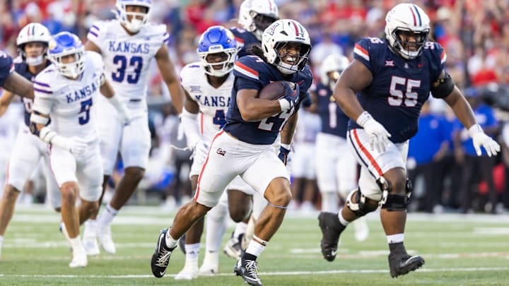 Nov 8, 2025; Tucson, Arizona, USA; Arizona Wildcats running back Quincy Craig (24) runs for a touchdown against the Kansas Jayhawks in the second half at Arizona Stadium. Mandatory Credit: Mark J. Rebilas-Imagn Images