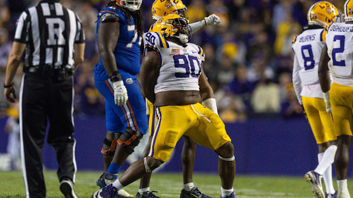Nov 11, 2023; Baton Rouge, Louisiana, USA; LSU Tigers defensive tackle Jacobian Guillory (90) reacts to a play against the Florida Gators during the second half at Tiger Stadium. Mandatory Credit: Stephen Lew-Imagn Images Nov 11, 2023; Baton Rouge, Louisiana, USA; LSU Tigers defensive tackle Jacobian Guillory (90) reacts to a play against the Florida Gators during the second half at Tiger Stadium. Mandatory Credit: Stephen Lew-Imagn Images