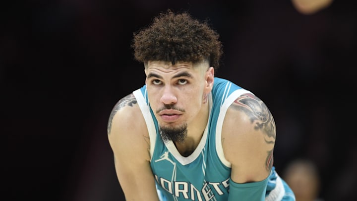 Nov 21, 2024; Charlotte, North Carolina, USA;  Charlotte Hornets guard LaMelo Ball (1) watches a foul shot during the second half against the Detroit Pistons at the Spectrum Center. Mandatory Credit: Sam Sharpe-Imagn Images