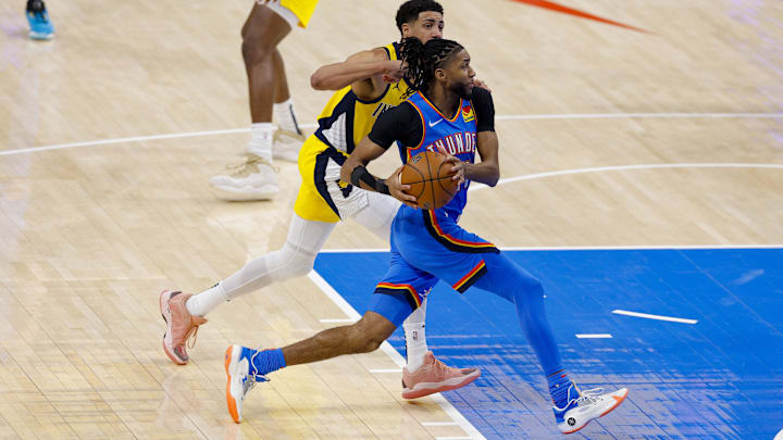 Jun 8, 2025; Oklahoma City, Oklahoma, USA; Oklahoma City Thunder guard Isaiah Joe (11) drives to the basket past Indiana Pacers guard Tyrese Haliburton (0) during the second quarter of game two of the 2025 NBA Finals at Paycom Center. Mandatory Credit: Alonzo Adams-Imagn Images