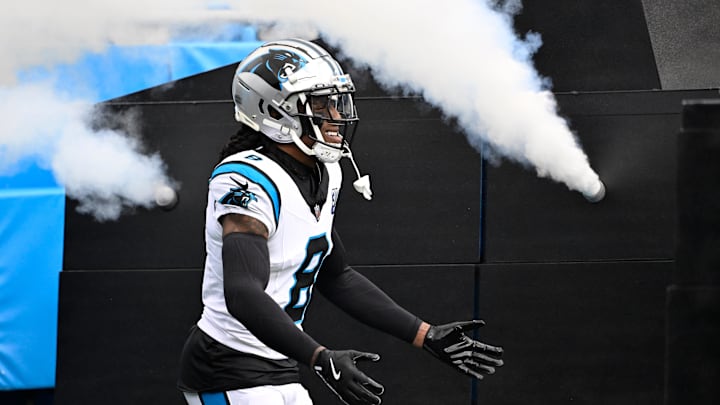 Dec 15, 2024; Charlotte, North Carolina, USA;  Carolina Panthers cornerback Jaycee Horn (8) runs on to the field before the game at Bank of America Stadium. Mandatory Credit: Bob Donnan-Imagn Images