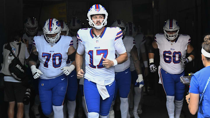 Buffalo Bills quarterback Josh Allen (17) leads the team during warmups before a preseason game against the Chicago Bears at Soldier Field.