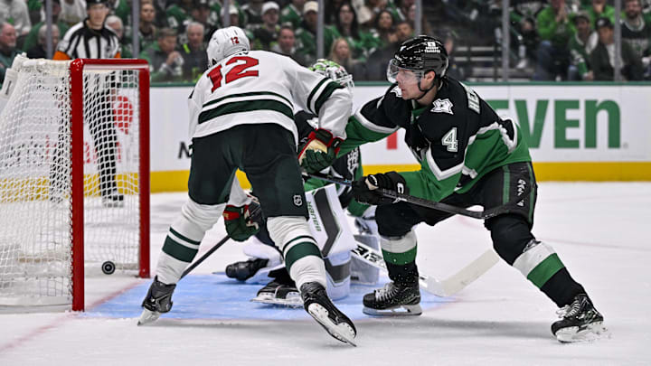 Apr 20, 2026; Dallas, Texas, USA; Minnesota Wild left wing Matt Boldy (12) and Dallas Stars defenseman Miro Heiskanen (4) watch as a shot by defenseman Brock Faber (not pictured) gets past goaltender Jake Oettinger (29) during the third period in game two of the first round of the 2026 Stanley Cup Playoffs at American Airlines Center. Mandatory Credit: Jerome Miron-Imagn Images