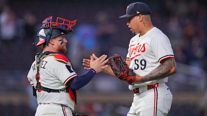 Jun 25, 2025; Minneapolis, Minnesota, USA; Minnesota Twins pitcher Jhoan Duran (59) and catcher Christian Vazquez (8) celebrate after the game against the Seattle Mariners at Target Field. Mandatory Credit: Brad Rempel-Imagn Images