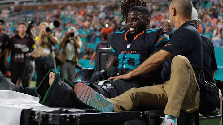 Sep 29, 2025; Miami Gardens, Florida, USA; Miami Dolphins wide receiver Tyreek Hill (10) reacts after being placed on a medical cart against the New York Jets during the second half at Hard Rock Stadium. Mandatory Credit: Sam Navarro-Imagn Images Sep 29, 2025; Miami Gardens, Florida, USA; Miami Dolphins wide receiver Tyreek Hill (10) reacts after being placed on a medical cart against the New York Jets during the second half at Hard Rock Stadium. Mandatory Credit: Sam Navarro-Imagn Images