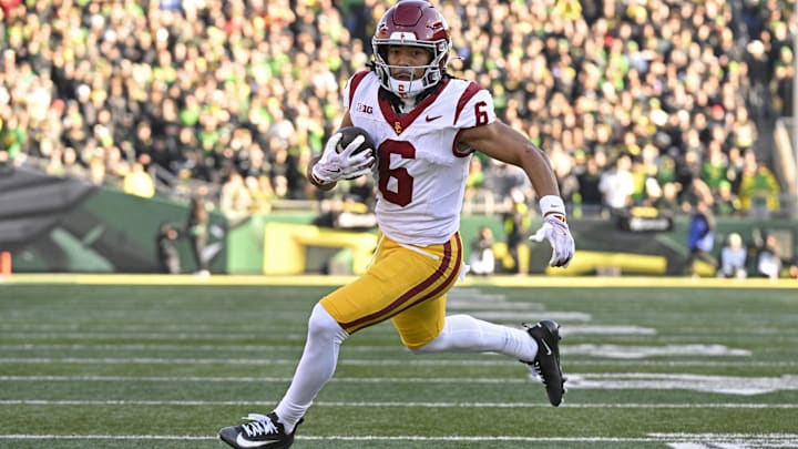 Nov 22, 2025; Eugene, Oregon, USA; Southern California Trojans wide receiver Makai Lemon (6) runs with the ball during the first half against the Oregon Ducks at Autzen Stadium. Mandatory Credit: Troy Wayrynen-Imagn Images