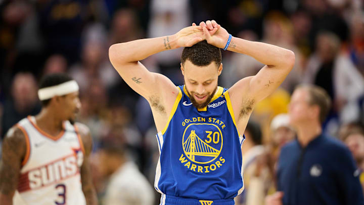 Dec 28, 2024; San Francisco, California, USA; Golden State Warriors guard Stephen Curry (30) reacts to a missed three point shot against the Phoenix Suns during the fourth quarter at Chase Center. 