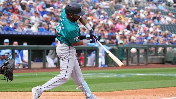 Seattle Mariners second baseman Samad Taylor hits a home run during a spring training game against the Kansas City Royals on March 6, 2024, at Surprise Stadium.