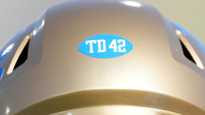 Sep 14, 2024; Pasadena, California, USA; A TD 42 sticker on the helmet of UCLA Bruins offensive lineman Kory Symington (63) in honor of Terry Donahue and Jackie Robinson during the game against the Indiana Hoosiers at Rose Bowl. Mandatory Credit: Kirby Lee-Imagn Images Sep 14, 2024; Pasadena, California, USA; A TD 42 sticker on the helmet of UCLA Bruins offensive lineman Kory Symington (63) in honor of Terry Donahue and Jackie Robinson during the game against the Indiana Hoosiers at Rose Bowl. Mandatory Credit: Kirby Lee-Imagn Images