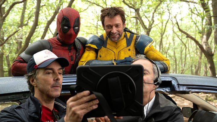 (L-R): Director Shawn Levy, Ryan Reynolds, and Hugh Jackman on the set of Marvel Studios' DEADPOOL & WOLVERINE. Photo by Jay Maidment. © 2024 20th Century Studios / © and ™ 2024 MARVEL.