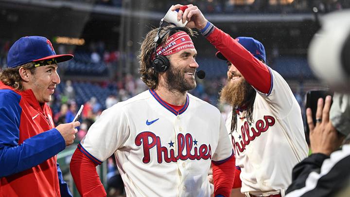 Sep 23, 2023; Philadelphia, Pennsylvania, USA;  Philadelphia Phillies center fielder Brandon Marsh and  second baseman Bryson Stott harass designated hitter Bryce Harper during a post game interview after the game against the New York Mets at Citizens Bank Park. Philadelphia won 7-5. Mandatory Credit: John Geliebter-Imagn Images