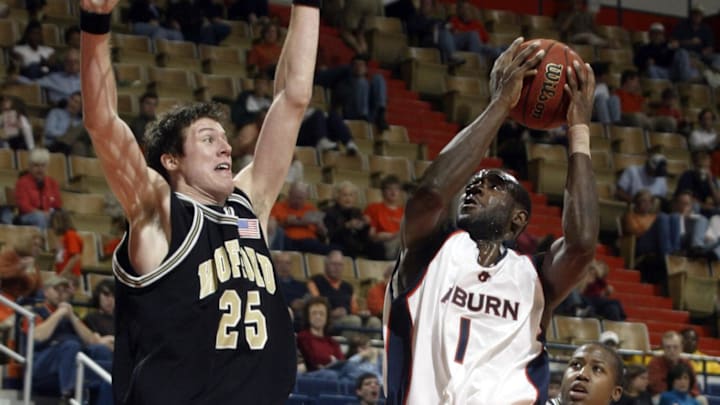 Dec 16, 2006; Auburn, AL, USA; Wofford Terriers forward (25) Tyler Whatley defends Auburn Tigers guard (1) Frank Tolbert at Beard-Eaves Memorial Coliseum in Auburn.  The Tigers beat the Terriers 86-76.  Mandatory Credit: Photo By John Reed-Imagn Images