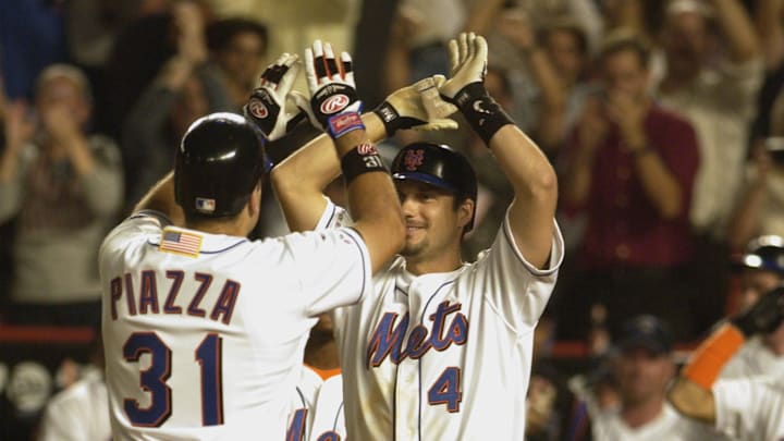 Mike Piazza is greeted by Robin Ventura following a home run on September 21, 2001 at Shea Stadium, just 10 days following the 9/11 attacks.