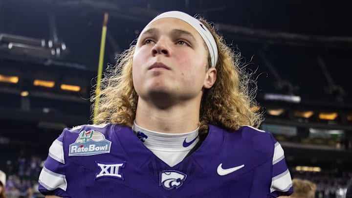 Dec 26, 2024; Phoenix, AZ, USA; Kansas State Wildcats quarterback Avery Johnson (2) against the Rutgers Scarlet Knights during the Rate Bowl at Chase Field. Mandatory Credit: Mark J. Rebilas-Imagn Images