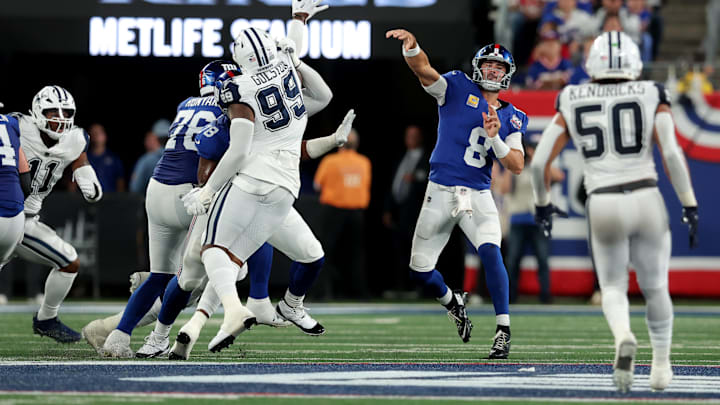 Sep 26, 2024; East Rutherford, New Jersey, USA; New York Giants quarterback Daniel Jones (8) throws a pass against the Dallas Cowboys during the second quarter at MetLife Stadium.  