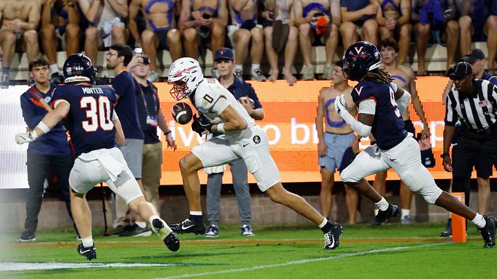Sep 26, 2025; Charlottesville, Virginia, USA; Florida State Seminoles wide receiver Duce Robinson (0) attempts to catch a game-tying touchdown pass as Virginia Cavaliers safety Ethan Minter (30) and Cavaliers cornerback Jam Jackson (9) chase in the second overtime at Scott Stadium. Mandatory Credit: Geoff Burke-Imagn Images Sep 26, 2025; Charlottesville, Virginia, USA; Florida State Seminoles wide receiver Duce Robinson (0) attempts to catch a game-tying touchdown pass as Virginia Cavaliers safety Ethan Minter (30) and Cavaliers cornerback Jam Jackson (9) chase in the second overtime at Scott Stadium. Mandatory Credit: Geoff Burke-Imagn Images