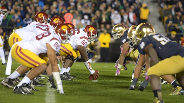Oct 19, 2013; South Bend, IN, USA; General view of the line of scrimmage as Southern California Trojans center Marcus Martin (66) snaps the ball to quarterback Cody Kessler (6) against the Notre Dame Fighting Irish at Notre Dame Stadium. Notre Dame won 14-10. Oct 19, 2013; South Bend, IN, USA; General view of the line of scrimmage as Southern California Trojans center Marcus Martin (66) snaps the ball to quarterback Cody Kessler (6) against the Notre Dame Fighting Irish at Notre Dame Stadium. Notre Dame won 14-10.