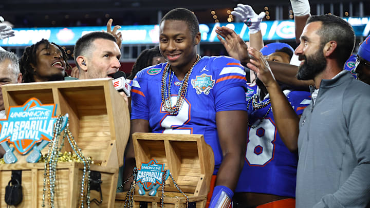Dec 20, 2024; Tampa, FL, USA; Florida Gators quarterback DJ Lagway (2) is presented the MVP trophy after the win against the Tulane Green Wave at Raymond James Stadium. Mandatory Credit: Kim Klement Neitzel-Imagn Images Dec 20, 2024; Tampa, FL, USA; Florida Gators quarterback DJ Lagway (2) is presented the MVP trophy after the win against the Tulane Green Wave at Raymond James Stadium. Mandatory Credit: Kim Klement Neitzel-Imagn Images