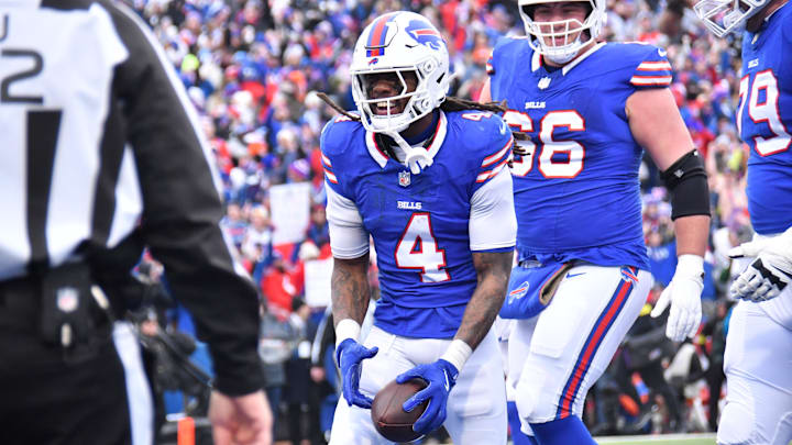 Jan 12, 2025; Orchard Park, New York, USA; Buffalo Bills running back James Cook (4) celebrates a touchdown during the second quarter against the Denver Broncos in an AFC wild card game at Highmark Stadium. Mandatory Credit: Mark Konezny-Imagn Images