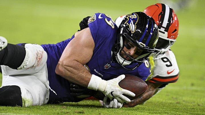 Jan 4, 2025; Baltimore, Maryland, USA; Baltimore Ravens tight end Mark Andrews (89) makes a catch for a touchdown during the second quarter as Cleveland Browns safety Grant Delpit (9) defends at M&T Bank Stadium. Mandatory Credit: Tommy Gilligan-Imagn Images