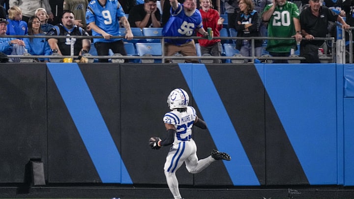 Indianapolis Colts cornerback Kenny Moore II (23) gets a pick six as fans cheer during the second half against the Carolina Panthers 