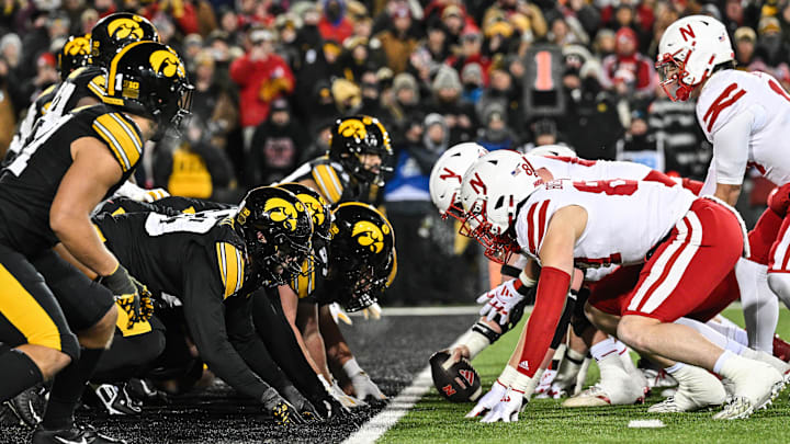 The line of scrimmage between the Iowa Hawkeyes and the Nebraska Cornhuskers at Kinnick Stadium.