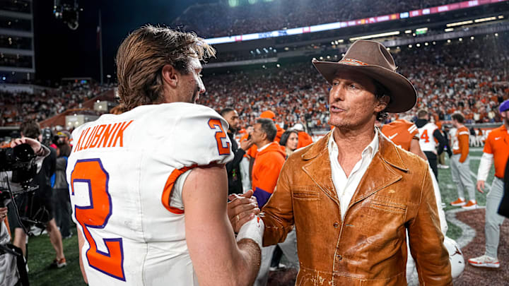 Dec 21, 2024; Austin, Texas, USA; Movie actor Matthew McConaughey (right) meets Clemson Tigers quarterback Cade Klubnik (2) after a victory by the Texas Longhorns in the first round of the College Football Playoffs at Darrell K Royal-Texas Memorial Stadium. Mandatory Credit: Aaron E. Martinez/USA Today Network via Imagn Images