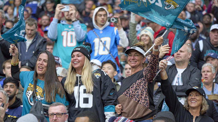 Oct 20, 2024; London, United Kingdom; Jacksonville Jaguars fans react after a touchdown in the first half during an NFL International Series game against the New England Patriots at Wembley Stadium. Mandatory Credit: Peter van den Berg-Imagn Images