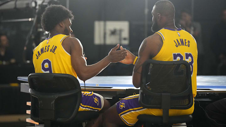 Los Angeles Lakers forward LeBron James (23) with son Bronny James (9) during media day at the UCLA Health Training Center.