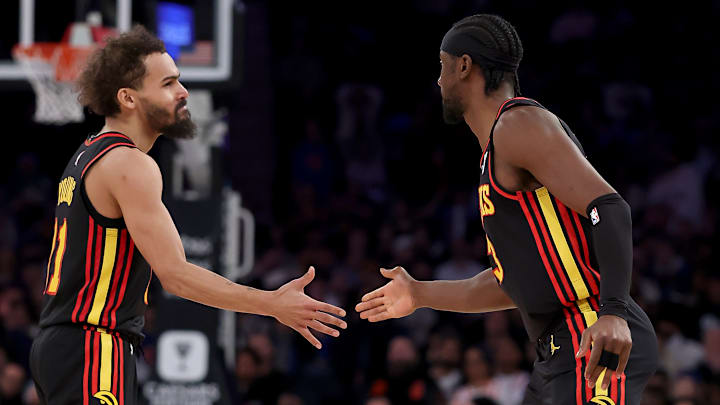 Trae Young #11 and Caris LeVert #3 of the Atlanta Hawks react against the New York Knicks.