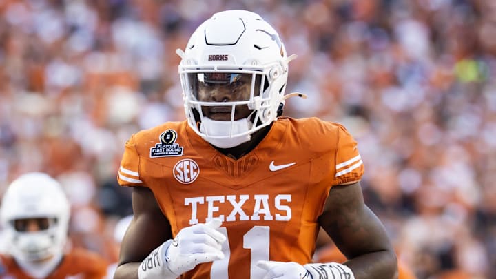 Dec 21, 2024; Austin, Texas, USA; Texas Longhorns linebacker Colin Simmons (11) against the Clemson Tigers during the CFP National playoff first round at Darrell K Royal-Texas Memorial Stadium. Mandatory Credit: Mark J. Rebilas-Imagn Images