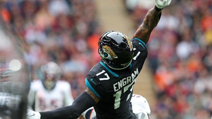 Oct 30, 2022; London, United Kingdom, Jacksonville Jaguars tight end Evan Engram (17) leaps for a pass against the Denver Broncos in the first quarter during an NFL International Series game at Wembley Stadium. Mandatory Credit: Nathan Ray Seebeck-Imagn Images